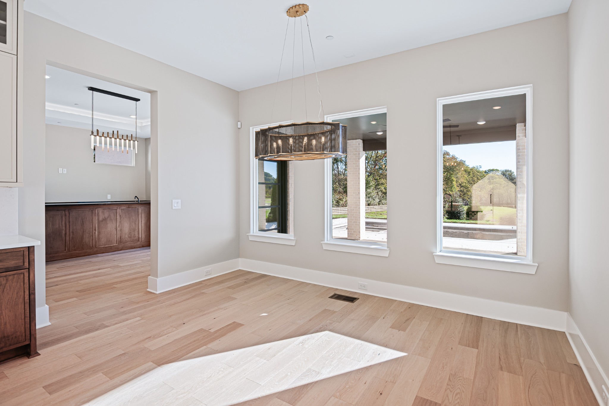1760 Dean Road Thompson's Station, TN 37179 - Photo 23 of 49 an empty room with wooden floor and windows