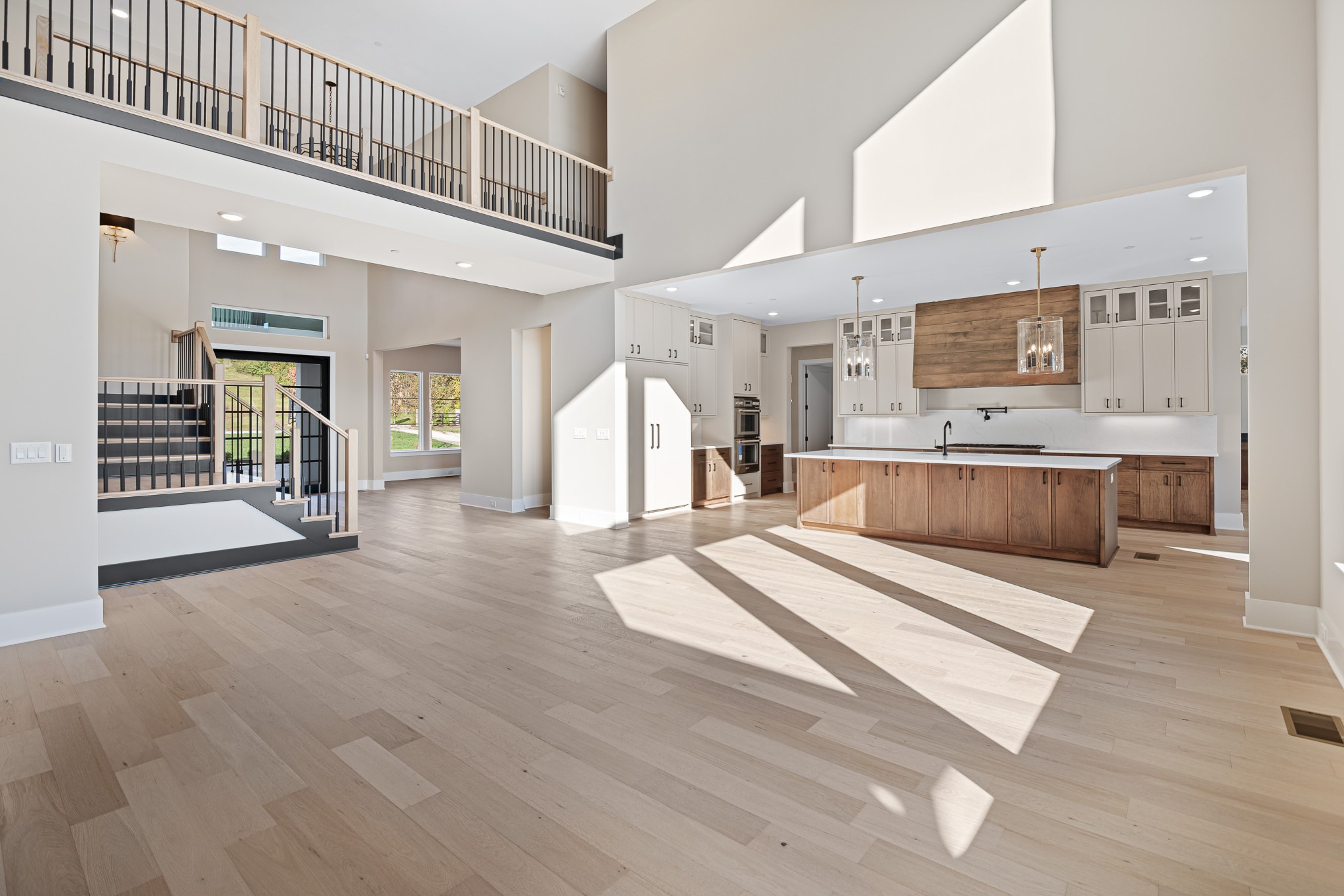 1760 Dean Road Thompson's Station, TN 37179 - Photo 24 of 49 a large white kitchen with a large window and stainless steel appliances