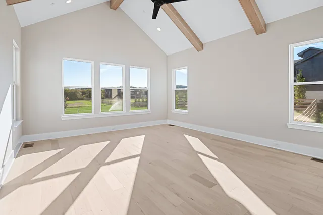 a view of an empty room with a window