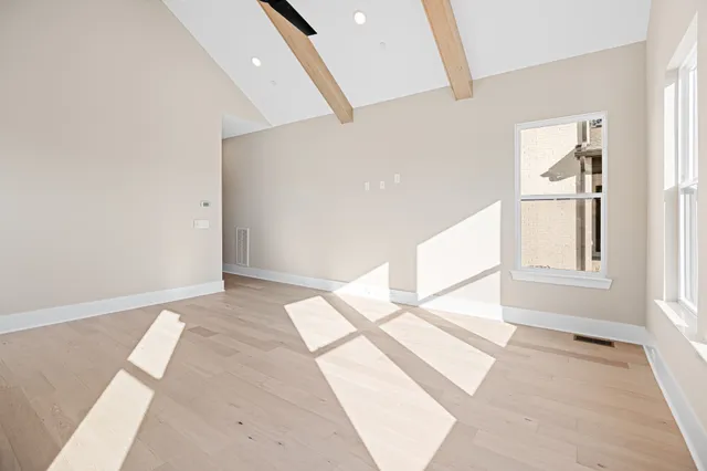 a view of an empty room and window