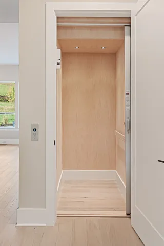 a view of a hardwood floor and a ceiling fan