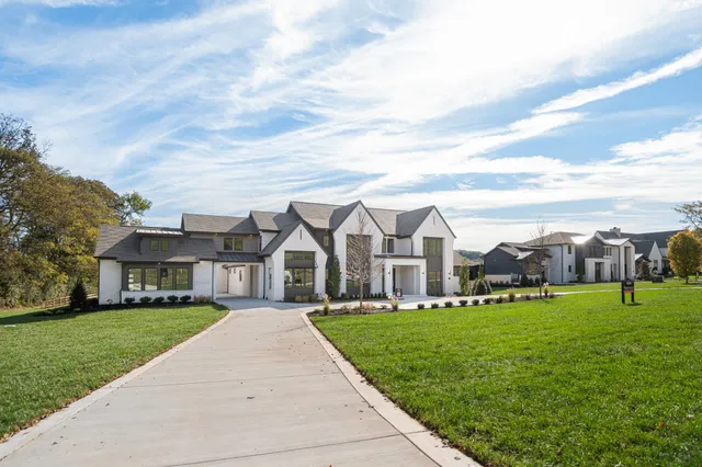 a front view of building with yard