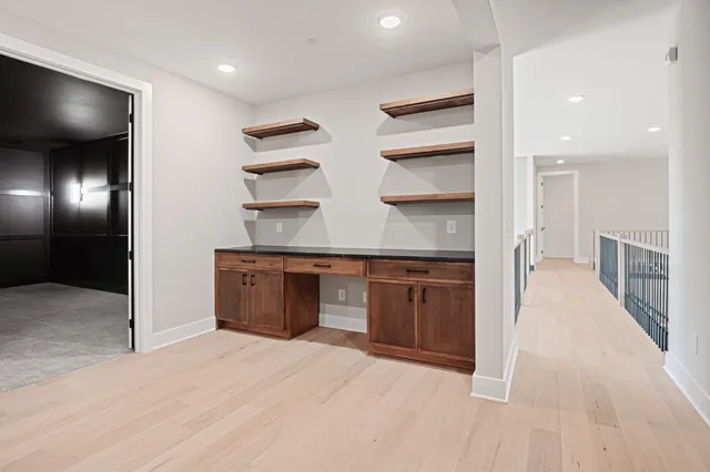 a kitchen with stainless steel appliances kitchen island a stove and a refrigerator