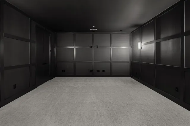 an aerial view of a house with swimming pool and mountains