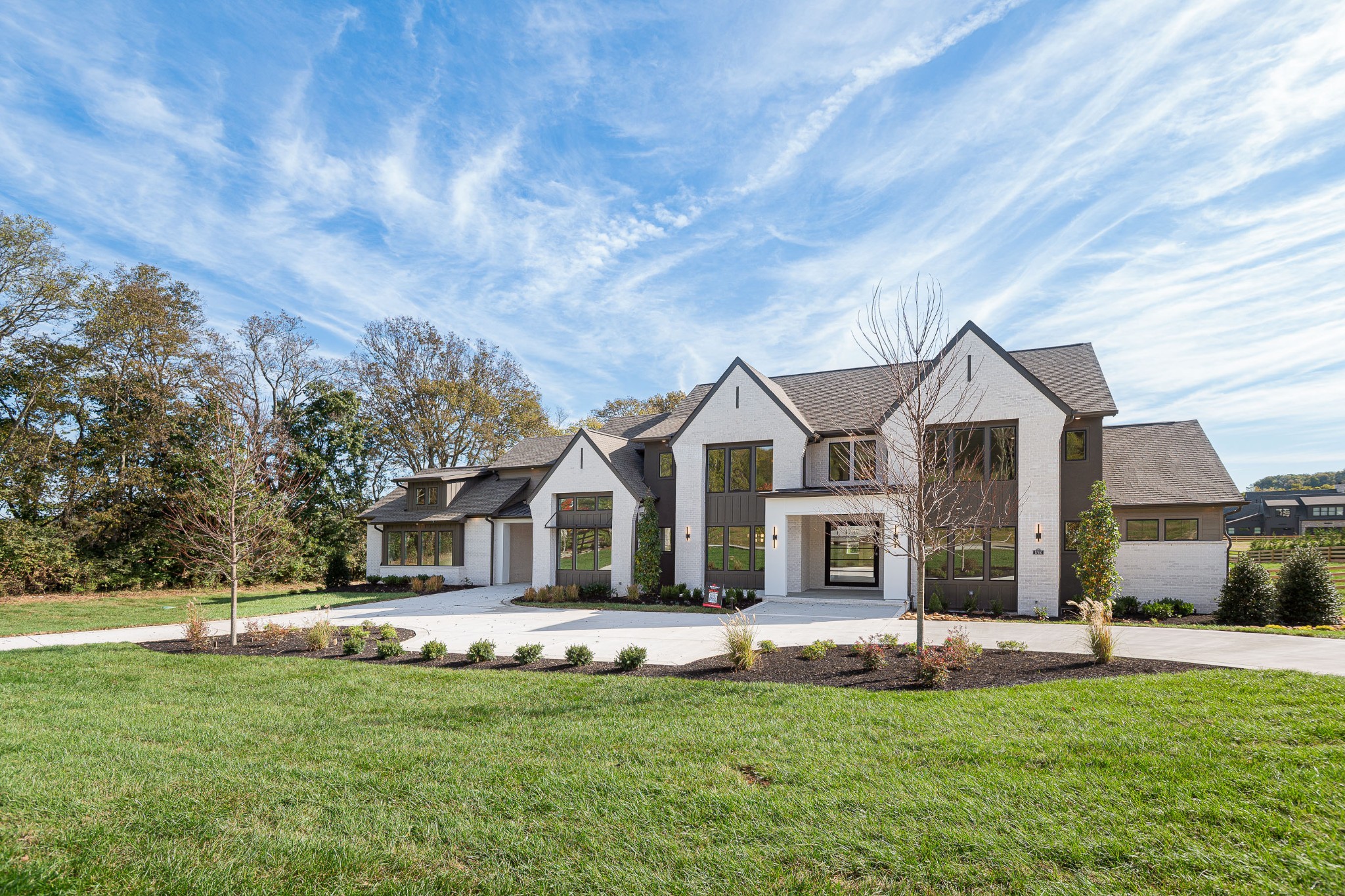 1760 Dean Road Thompson's Station, TN 37179 - Photo 6 of 49 a front view of a house with a garden and yard
