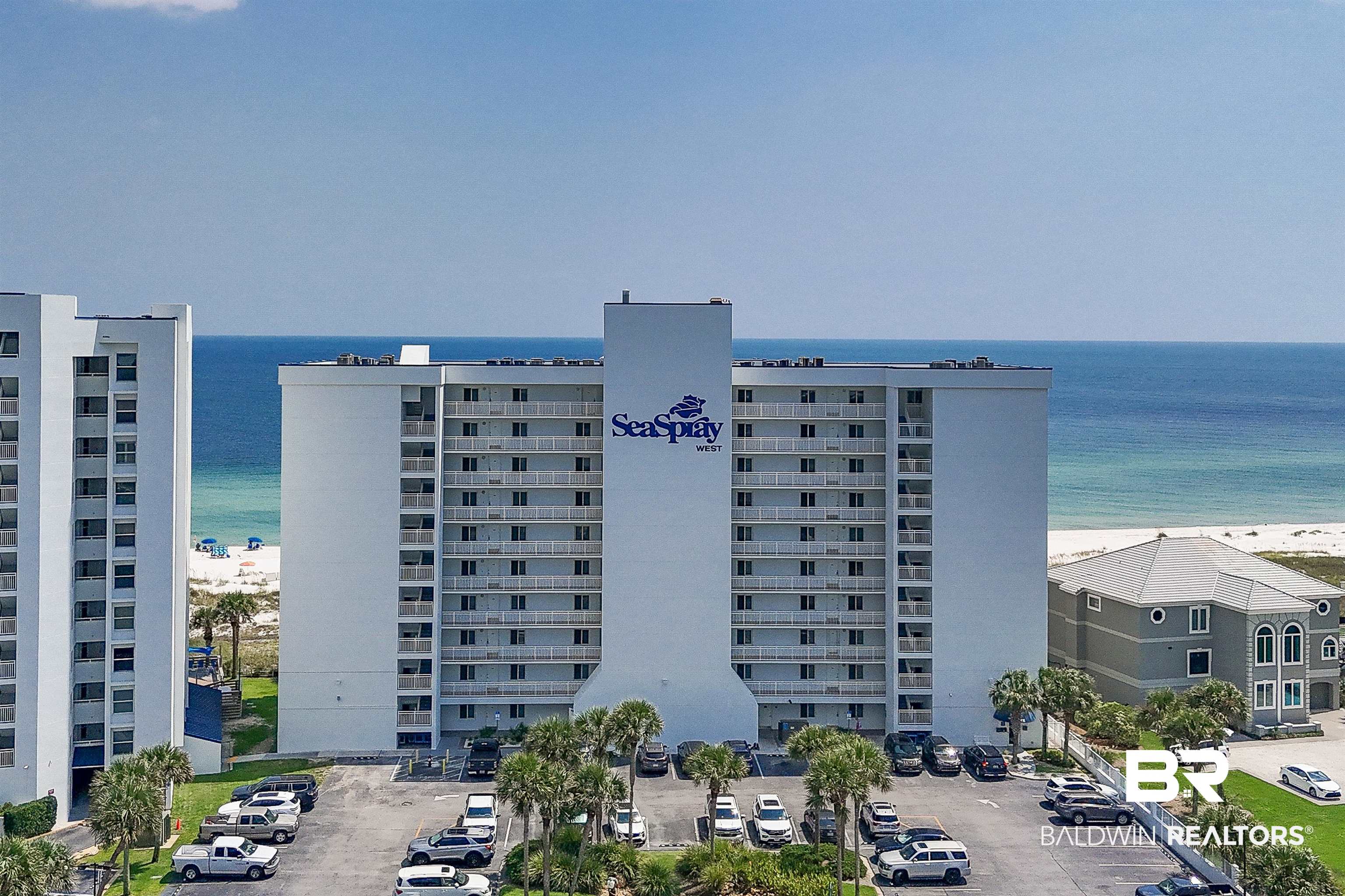 16287 Perdido Key Drive, Unit 105 Pensacola, FL 32507 - Photo 1 of 66 Multi-story residential building featuring numerous private balconies with white railings