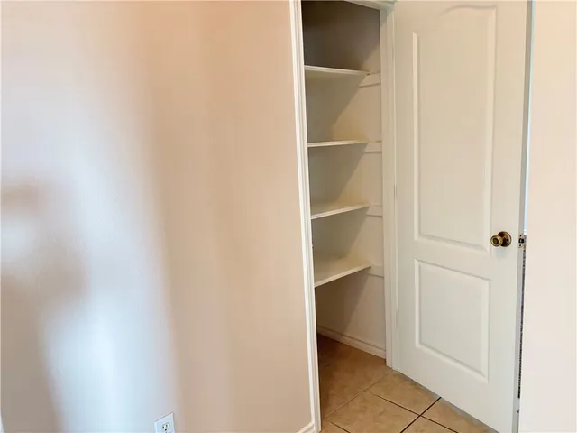 a view of an empty walk in closet