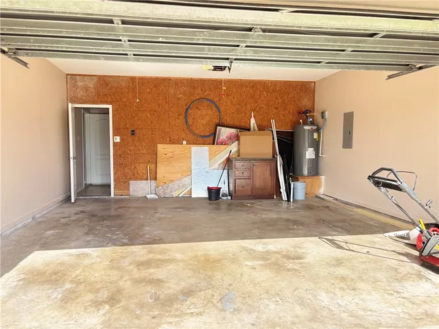 a view of staircase with wooden floor and fan