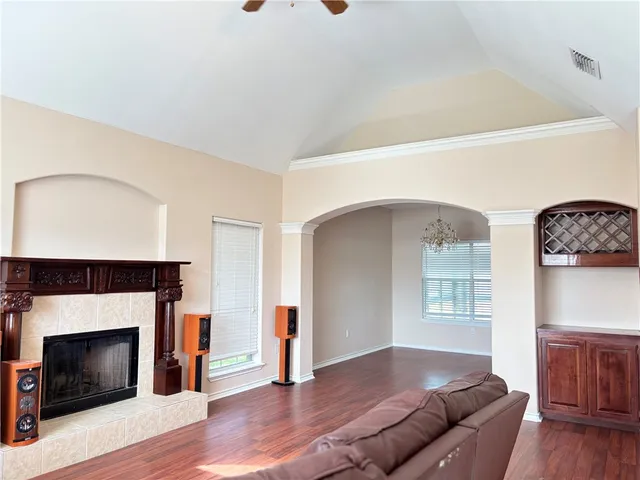 a living room with furniture and a fireplace