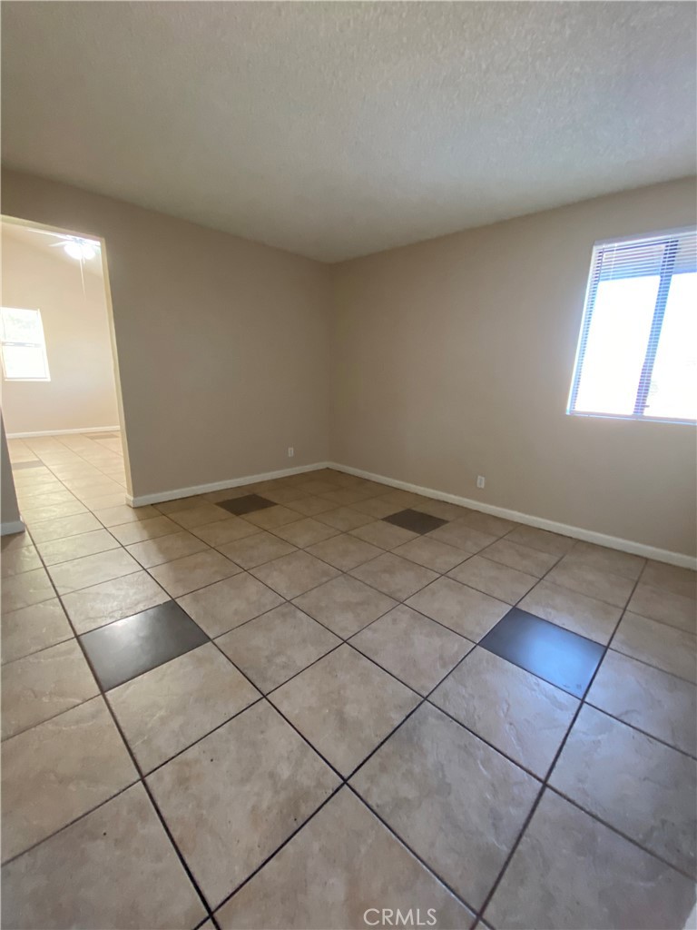18746 Rock Springs Road Hesperia, CA 92345 - Photo 13 of 21 a view of a room with white tiles