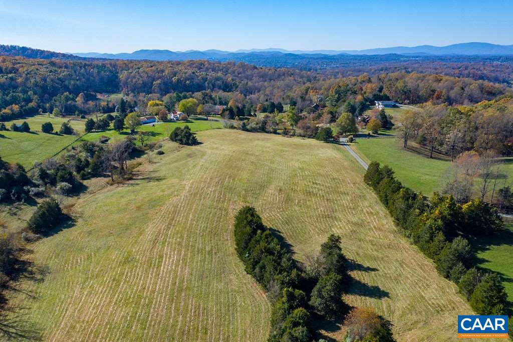 955 Wolf Trap Road Charlottesville, VA 22911 - Photo 27 of 30 a view of a lush green hillside and houses with a yard