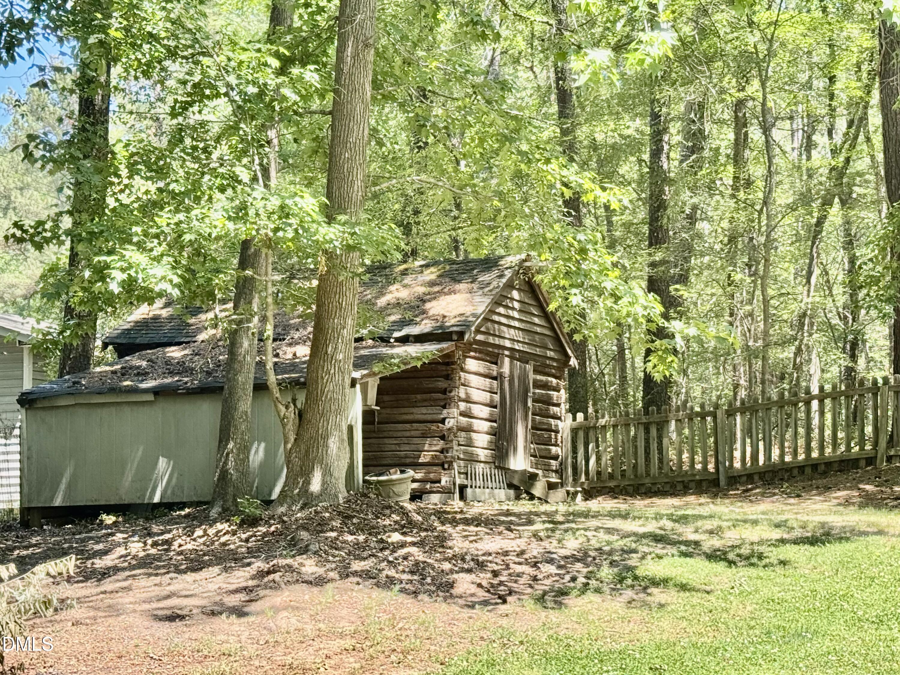 84 Wintergreen Road Henderson, NC 27537 - Photo 44 of 49 a view of a house with a yard