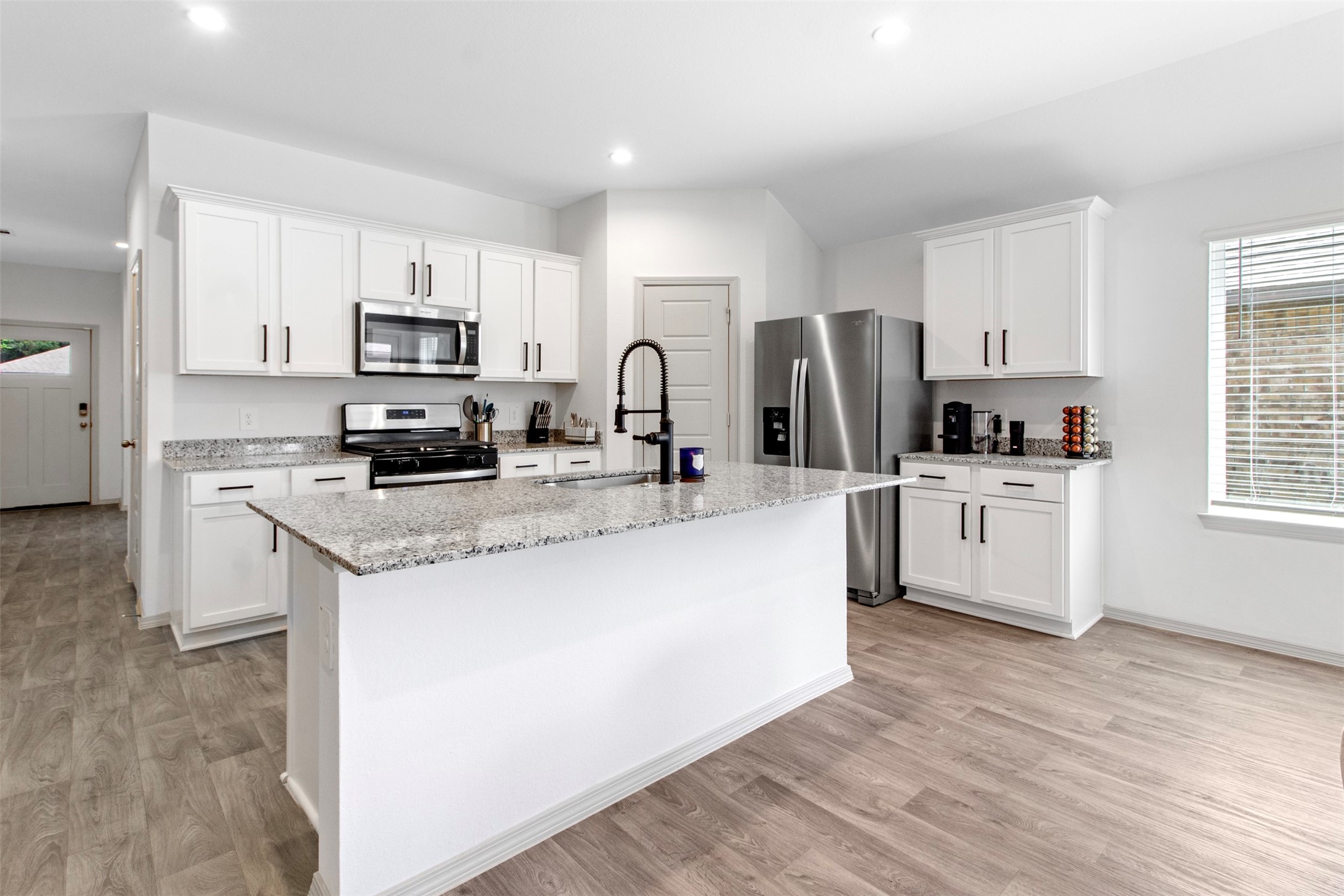 6685 Riplee Street Beaumont, TX 77713 - Photo 11 of 29 Beautiful White kitchen with white cabinets and granite countertops
