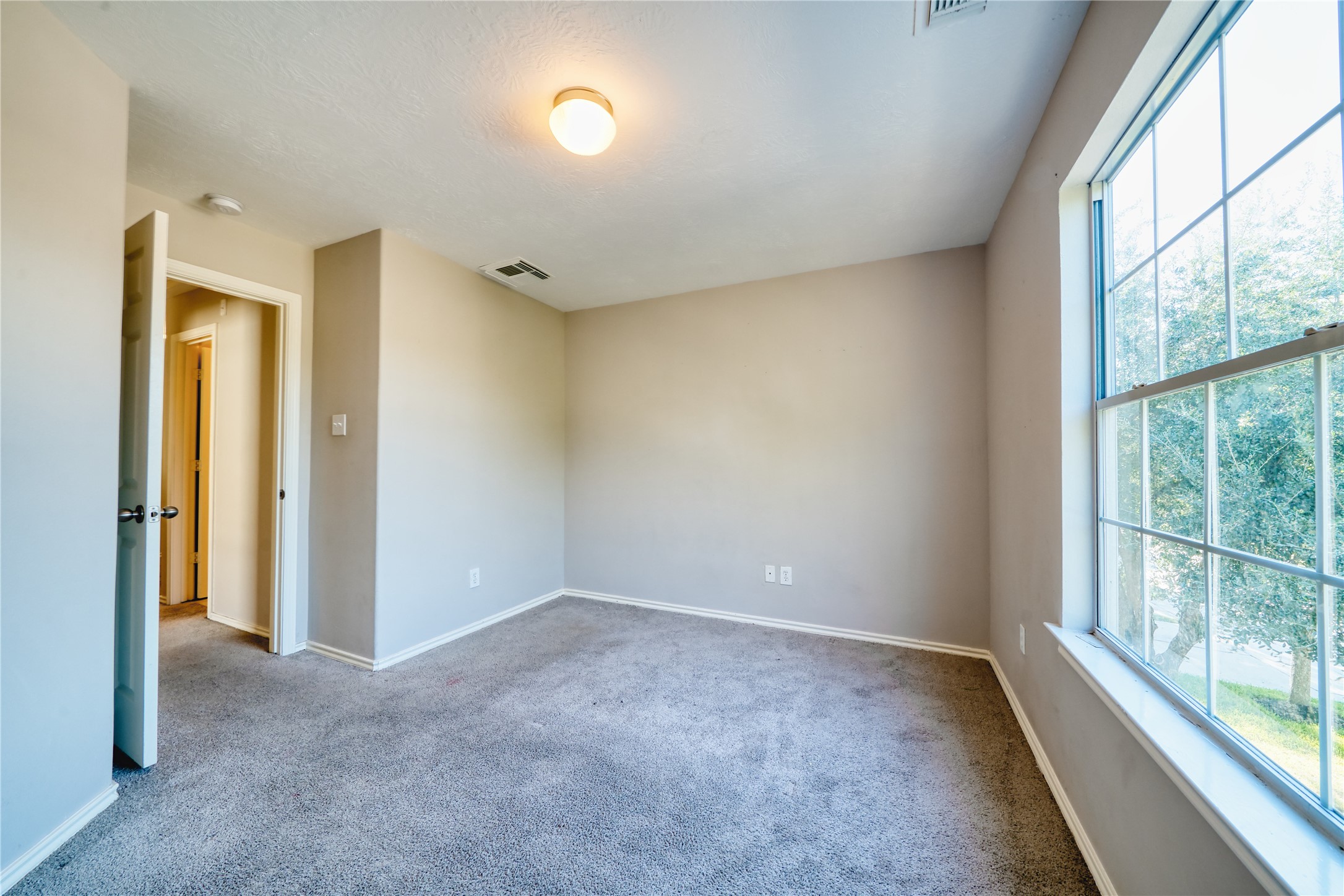 2907 Hackamore Houston, TX 77014 - Photo 20 of 33 a view of an empty room and a window