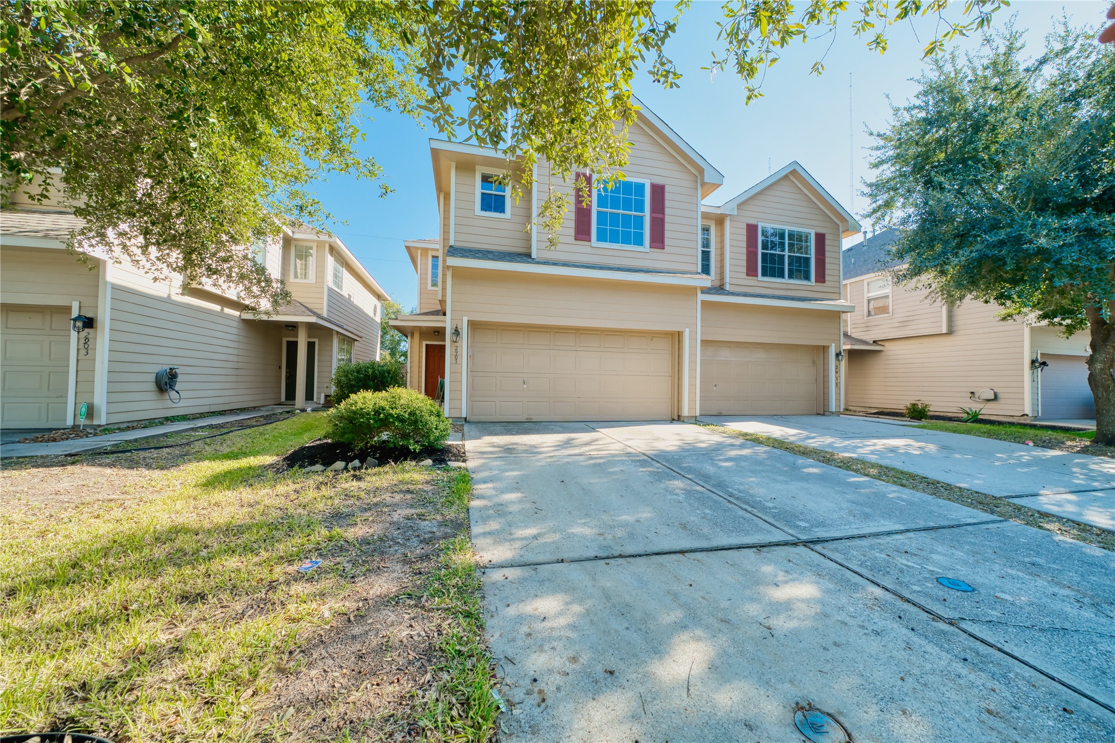 2907 Hackamore Houston, TX 77014 - Photo 2 of 33 a front view of a house with a yard and garage