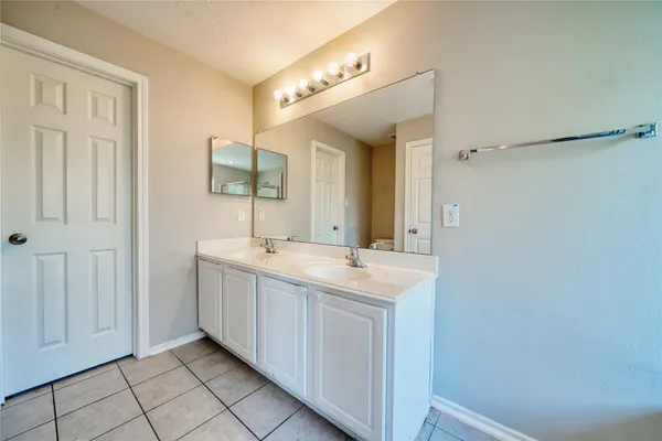 a bathroom with a tub and shower