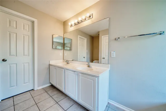 a bathroom with a tub and shower