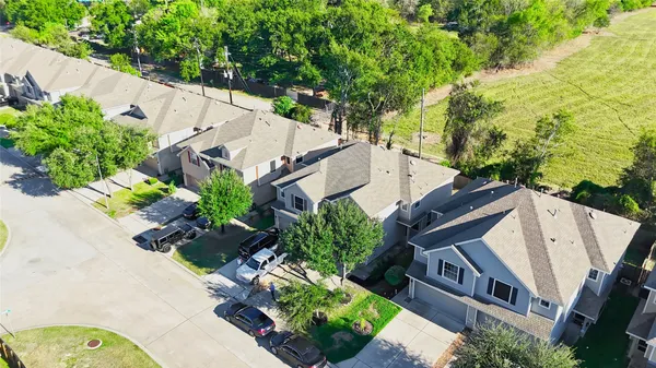 a view of a house with outdoor space and a lake view