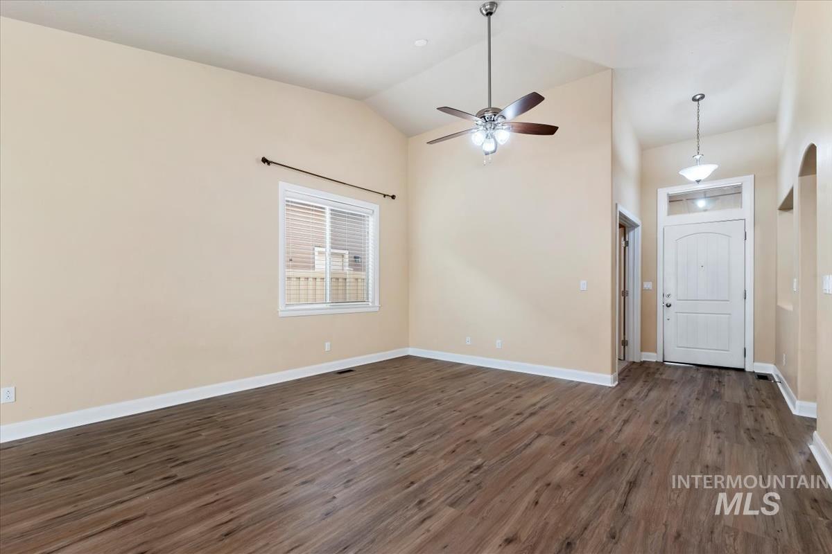 1838 Ridge Way Middleton, ID 83644 - Photo 12 of 42 Foyer with dark wood-style floors, ceiling fan, and high vaulted ceiling