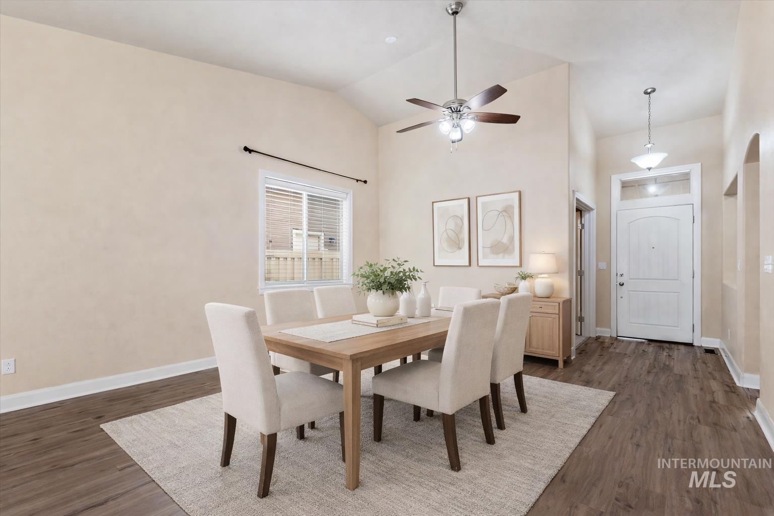 1838 Ridge Way Middleton, ID 83644 - Photo 2 of 42 Dining area with dark wood-type flooring, a ceiling fan, and high vaulted ceiling