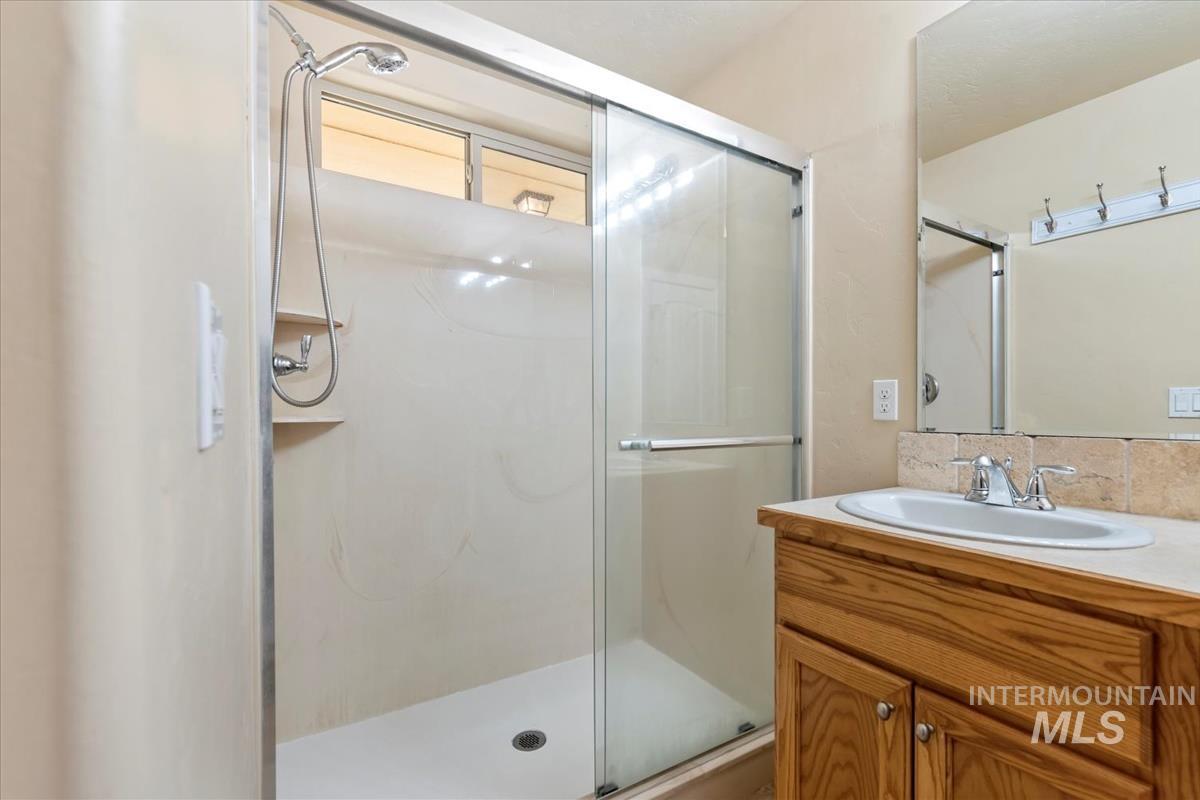 1838 Ridge Way Middleton, ID 83644 - Photo 32 of 42 Full bathroom featuring a shower stall and vanity