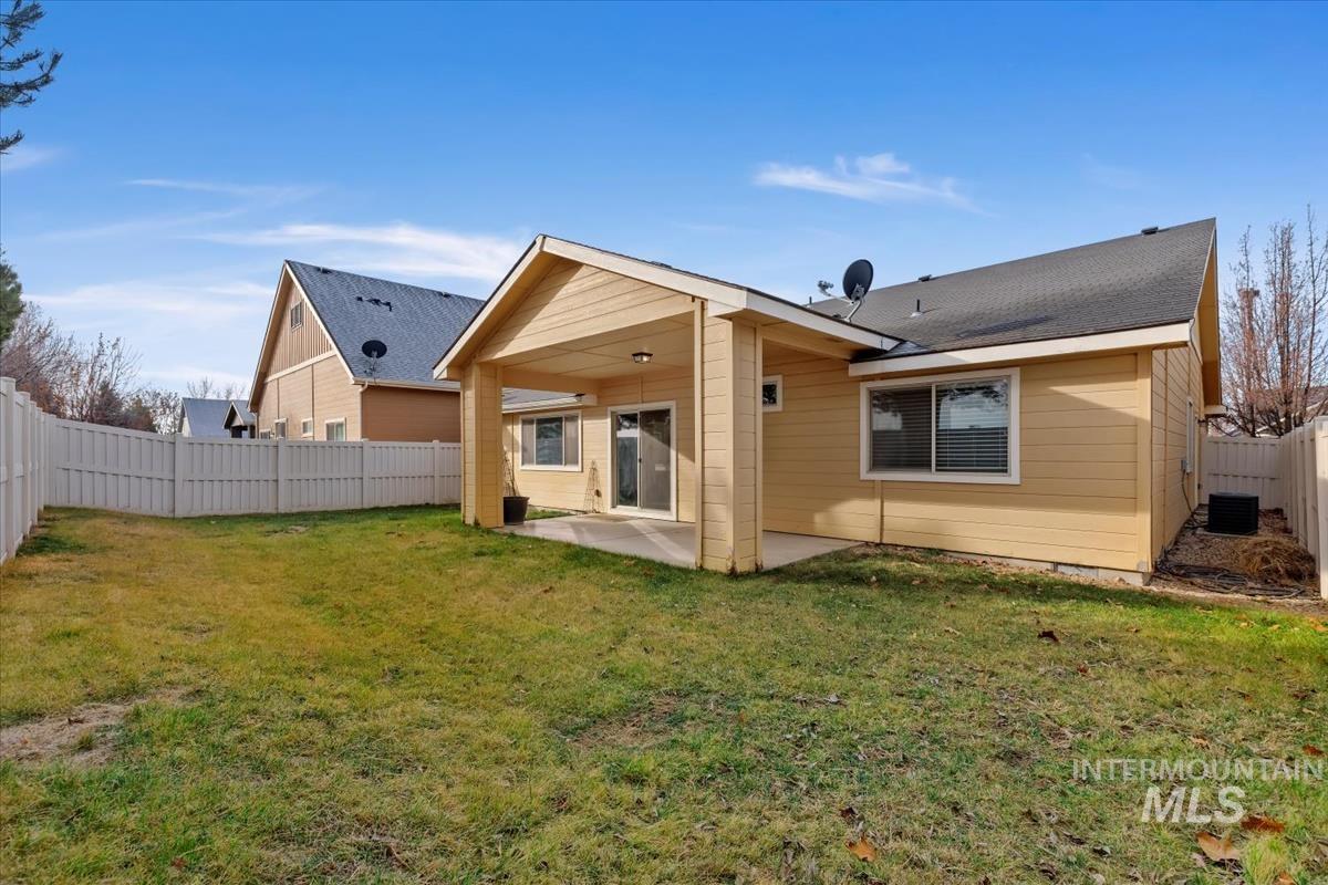 1838 Ridge Way Middleton, ID 83644 - Photo 36 of 42 Back of house featuring a fenced backyard and a patio area