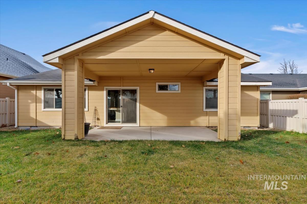 1838 Ridge Way Middleton, ID 83644 - Photo 38 of 42 Back of house featuring a fenced backyard and a patio
