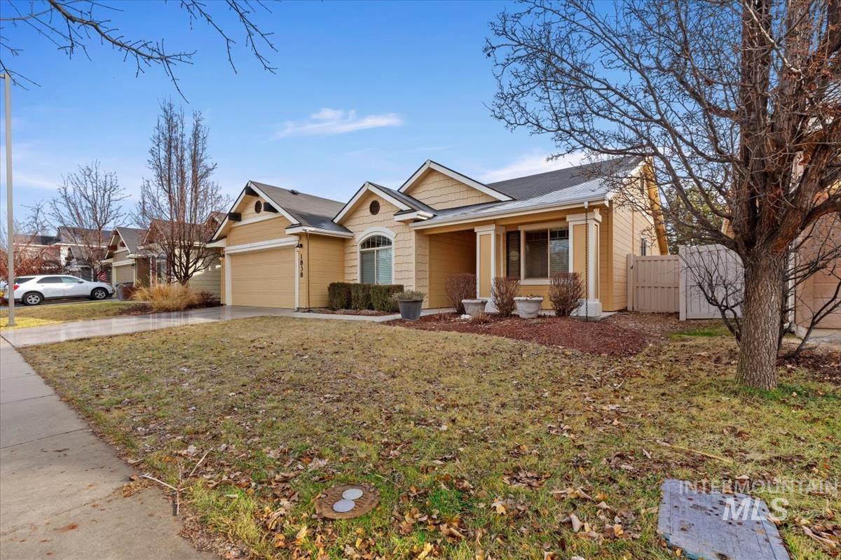 1838 Ridge Way Middleton, ID 83644 - Photo 41 of 42 Craftsman-style home featuring concrete driveway, a porch, a gate, and a garage