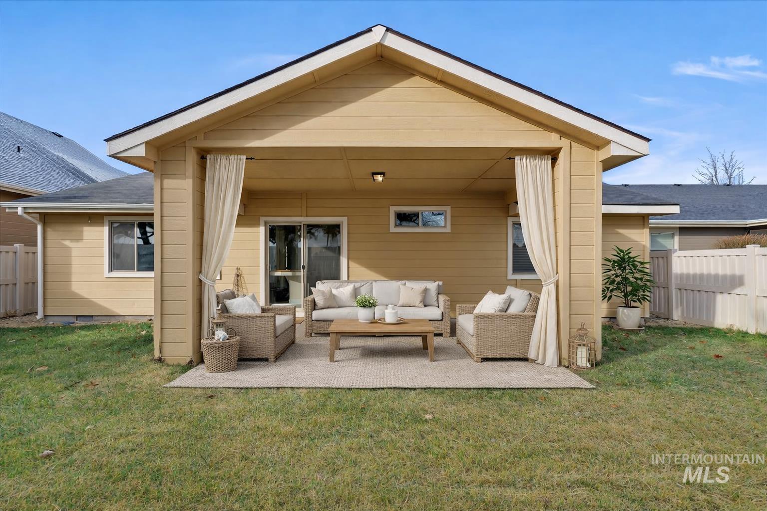1838 Ridge Way Middleton, ID 83644 - Photo 7 of 42 Rear view of house featuring a patio and an outdoor hangout area