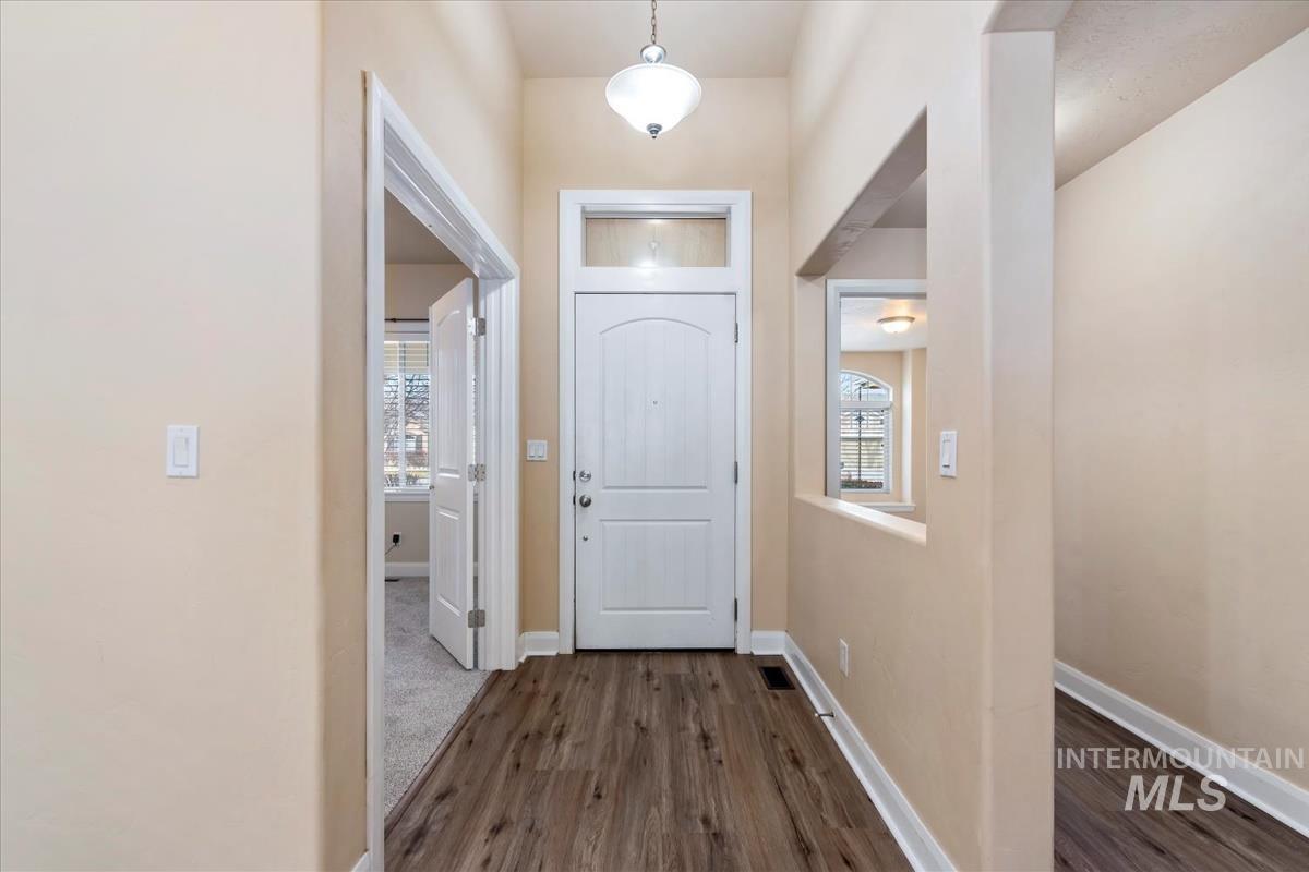 1838 Ridge Way Middleton, ID 83644 - Photo 10 of 42 Entryway featuring dark wood-type flooring and healthy amount of natural light