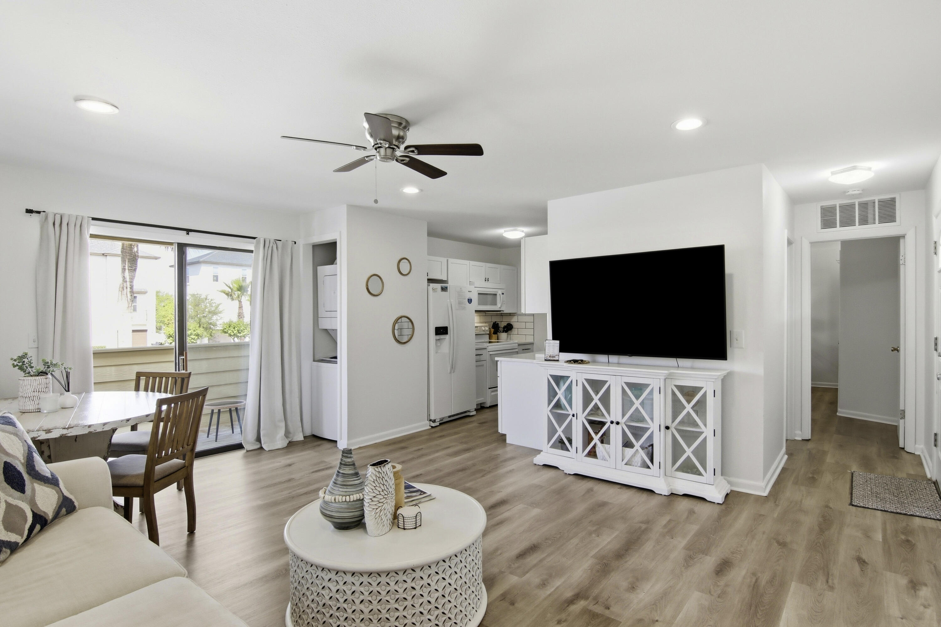 64 Cross Creek Road, Unit 28D Miramar Beach, FL 32550 - Photo 14 of 34 a living room with furniture and a flat screen tv