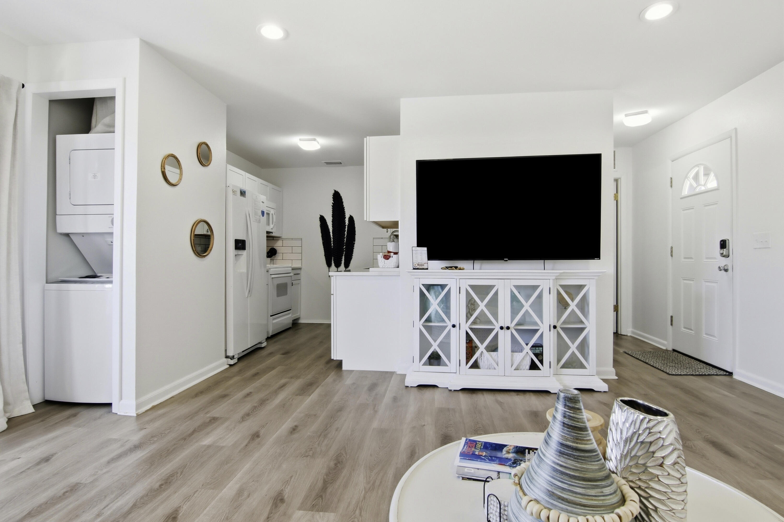 64 Cross Creek Road, Unit 28D Miramar Beach, FL 32550 - Photo 15 of 34 a living room with furniture and a flat screen tv