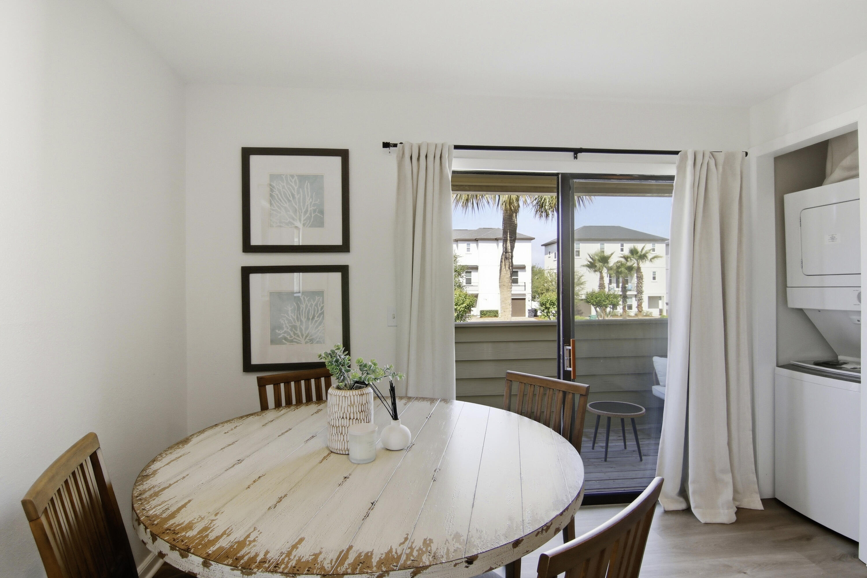 64 Cross Creek Road, Unit 28D Miramar Beach, FL 32550 - Photo 20 of 34 a table and chairs in a room