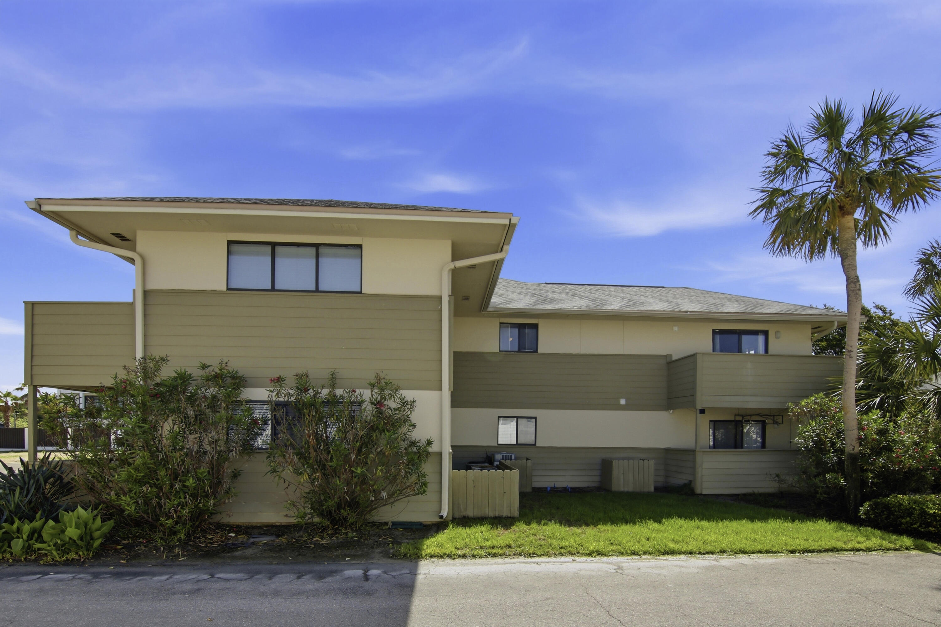64 Cross Creek Road, Unit 28D Miramar Beach, FL 32550 - Photo 2 of 34 a front view of a house with garden