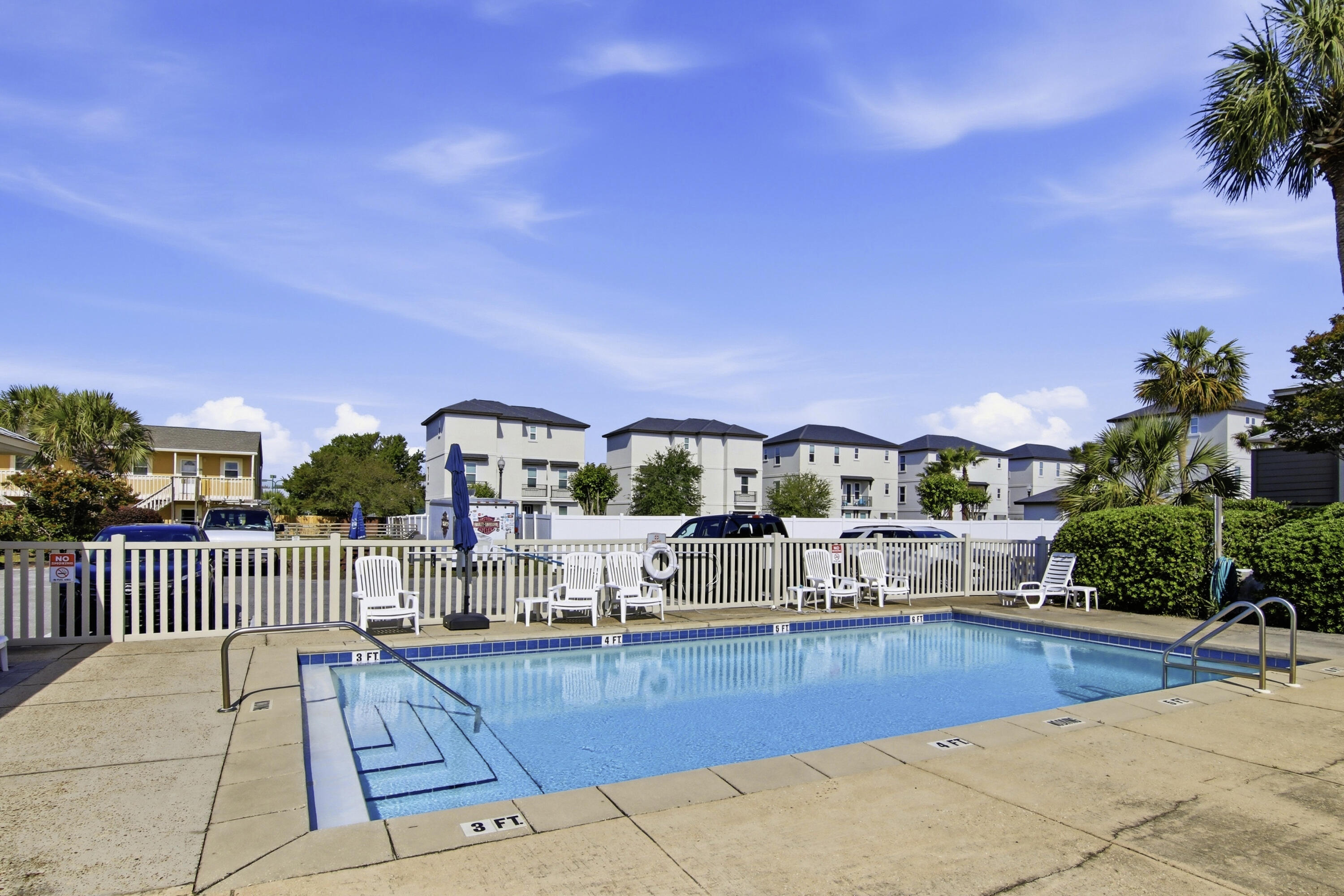 64 Cross Creek Road, Unit 28D Miramar Beach, FL 32550 - Photo 31 of 34 a view of a house with swimming pool and sitting area