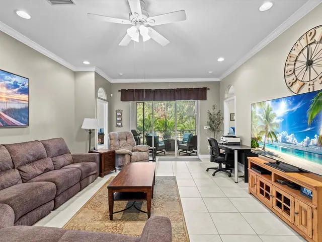 a bathroom with a granite countertop sink a toilet and a mirror