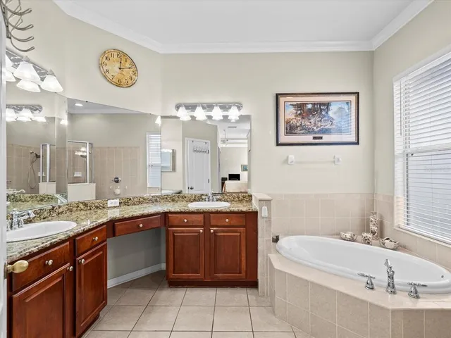 a view of swimming pool with outdoor seating and lake in the back