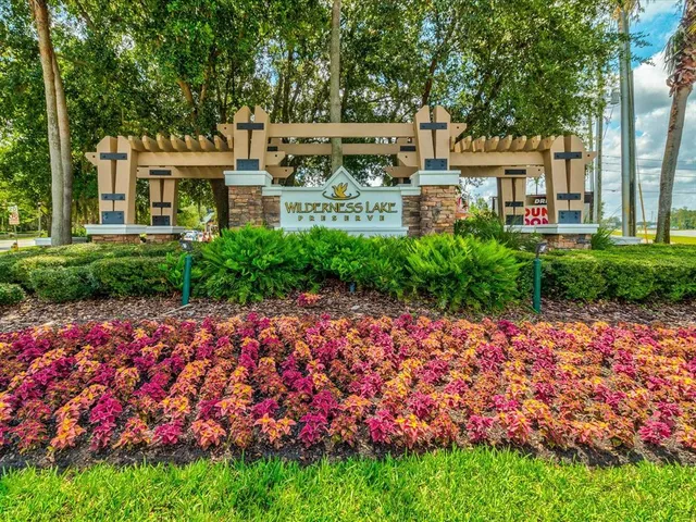 a view of a porch with furniture and a yard
