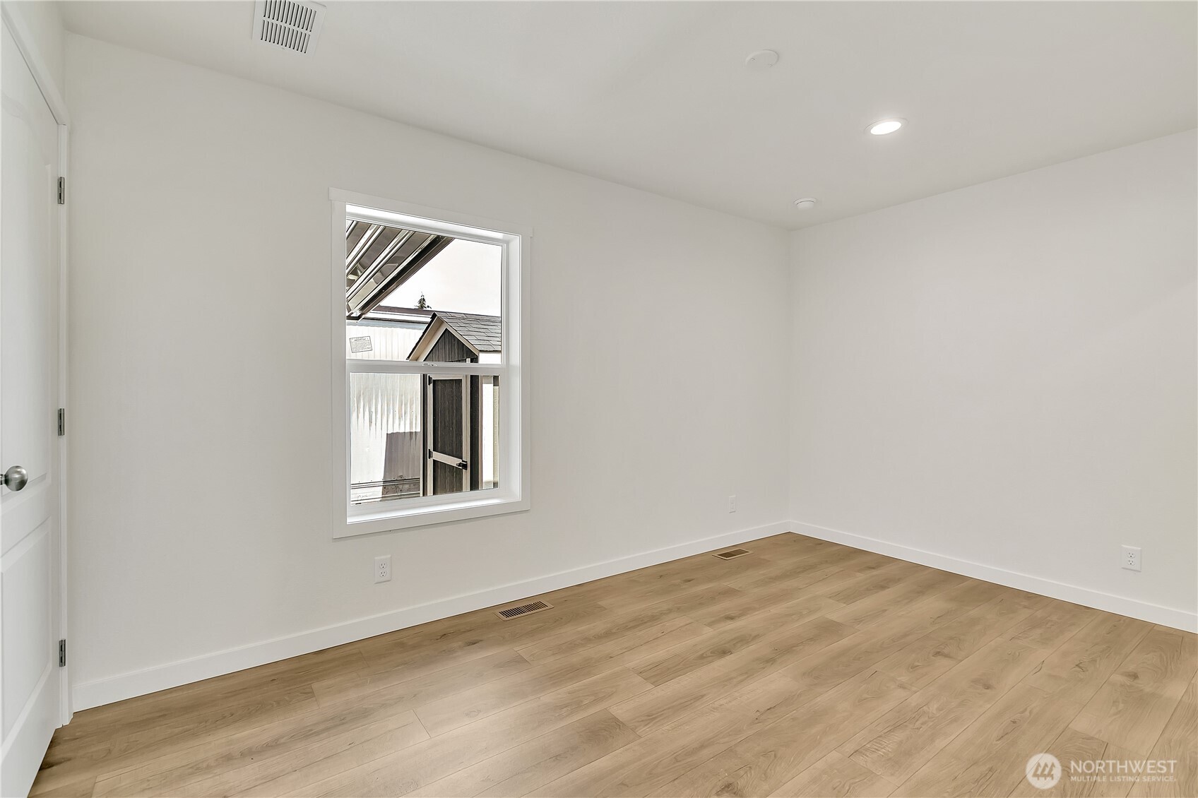 3237 South 182nd Place, Unit 221 SeaTac, WA 98188 - Photo 11 of 14 an empty room with a window