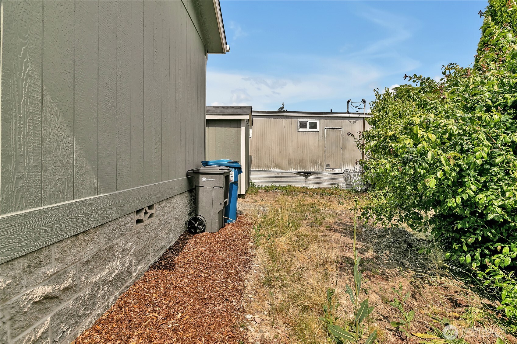 3237 South 182nd Place, Unit 221 SeaTac, WA 98188 - Photo 14 of 14 a view of a backyard of the house