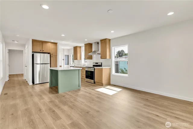 a view of kitchen with wooden floor