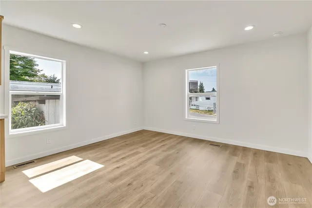 a kitchen with stainless steel appliances a stove a refrigerator and a sink