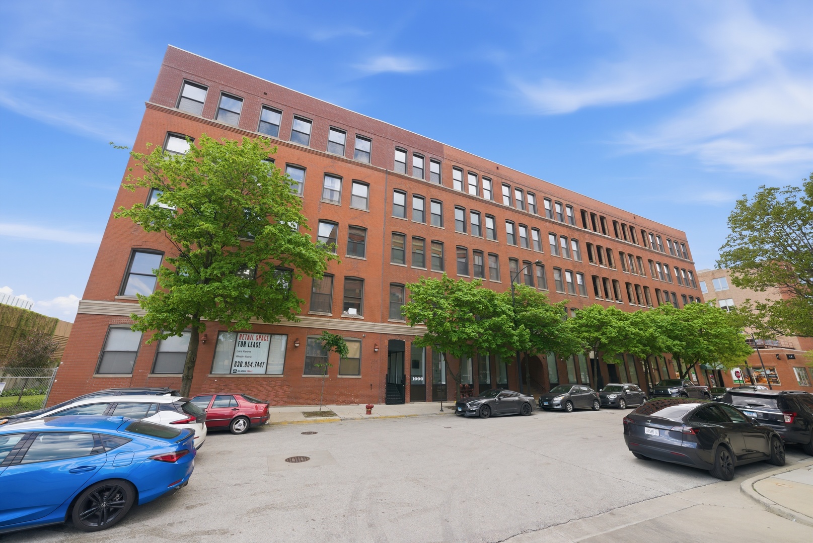 400 South Green Street, Unit 310 Chicago, IL 60607 - Photo 1 of 43 a car parked in front of a building