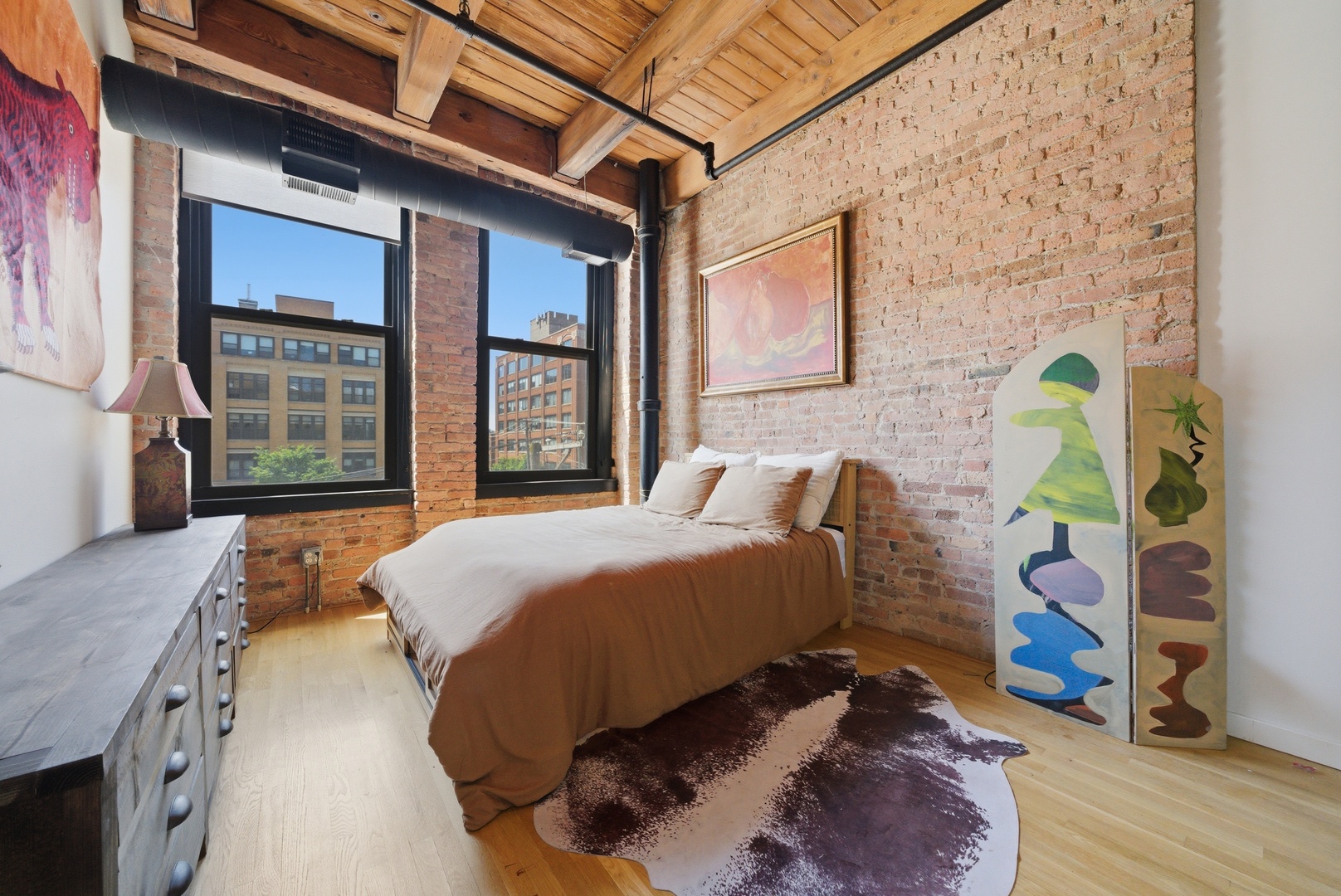 400 South Green Street, Unit 310 Chicago, IL 60607 - Photo 11 of 43 a bedroom with bed and wooden floor