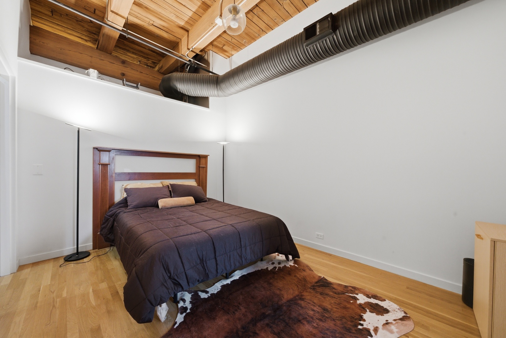 400 South Green Street, Unit 310 Chicago, IL 60607 - Photo 13 of 43 a bedroom with a bed and wooden floor