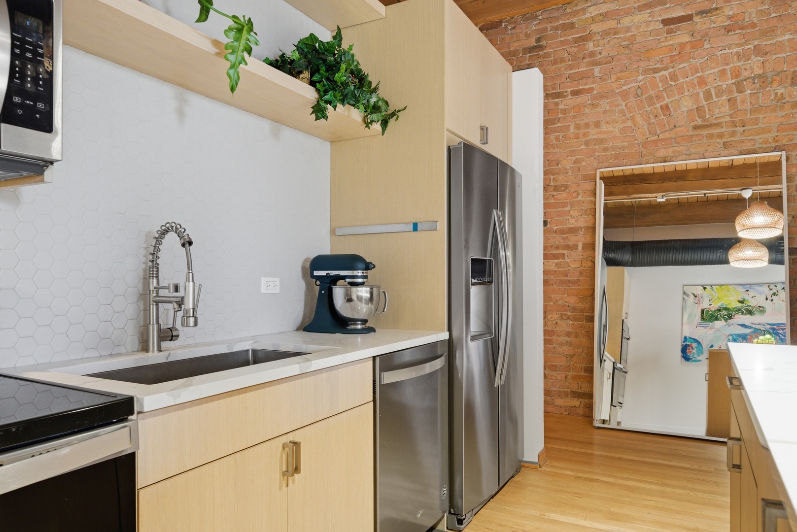 400 South Green Street, Unit 310 Chicago, IL 60607 - Photo 19 of 43 a kitchen with a refrigerator and a sink