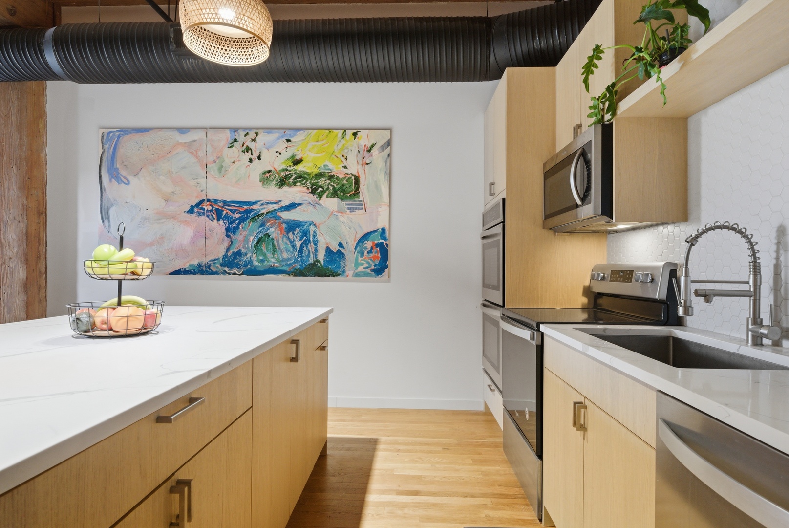 400 South Green Street, Unit 310 Chicago, IL 60607 - Photo 20 of 43 a kitchen with stainless steel appliances a stove a sink and a microwave