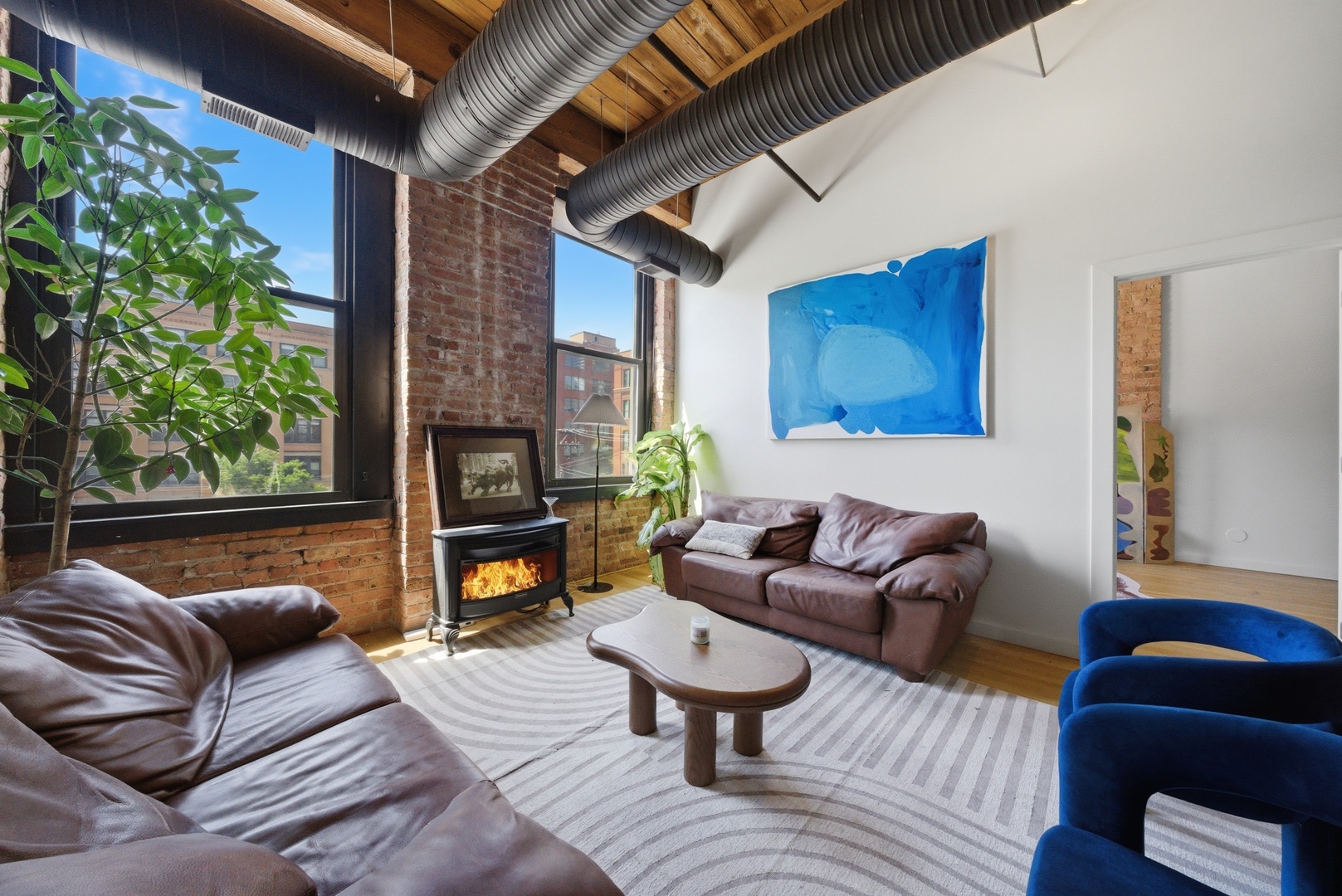 400 South Green Street, Unit 310 Chicago, IL 60607 - Photo 27 of 43 a living room with furniture and a fireplace