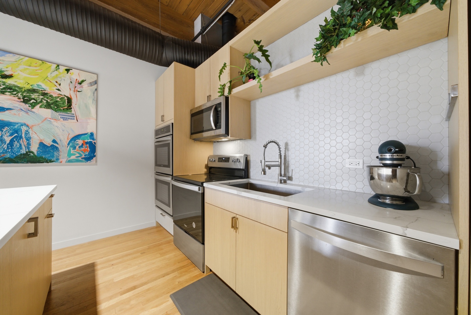 400 South Green Street, Unit 310 Chicago, IL 60607 - Photo 29 of 43 a kitchen with stainless steel appliances granite countertop a sink and a refrigerator