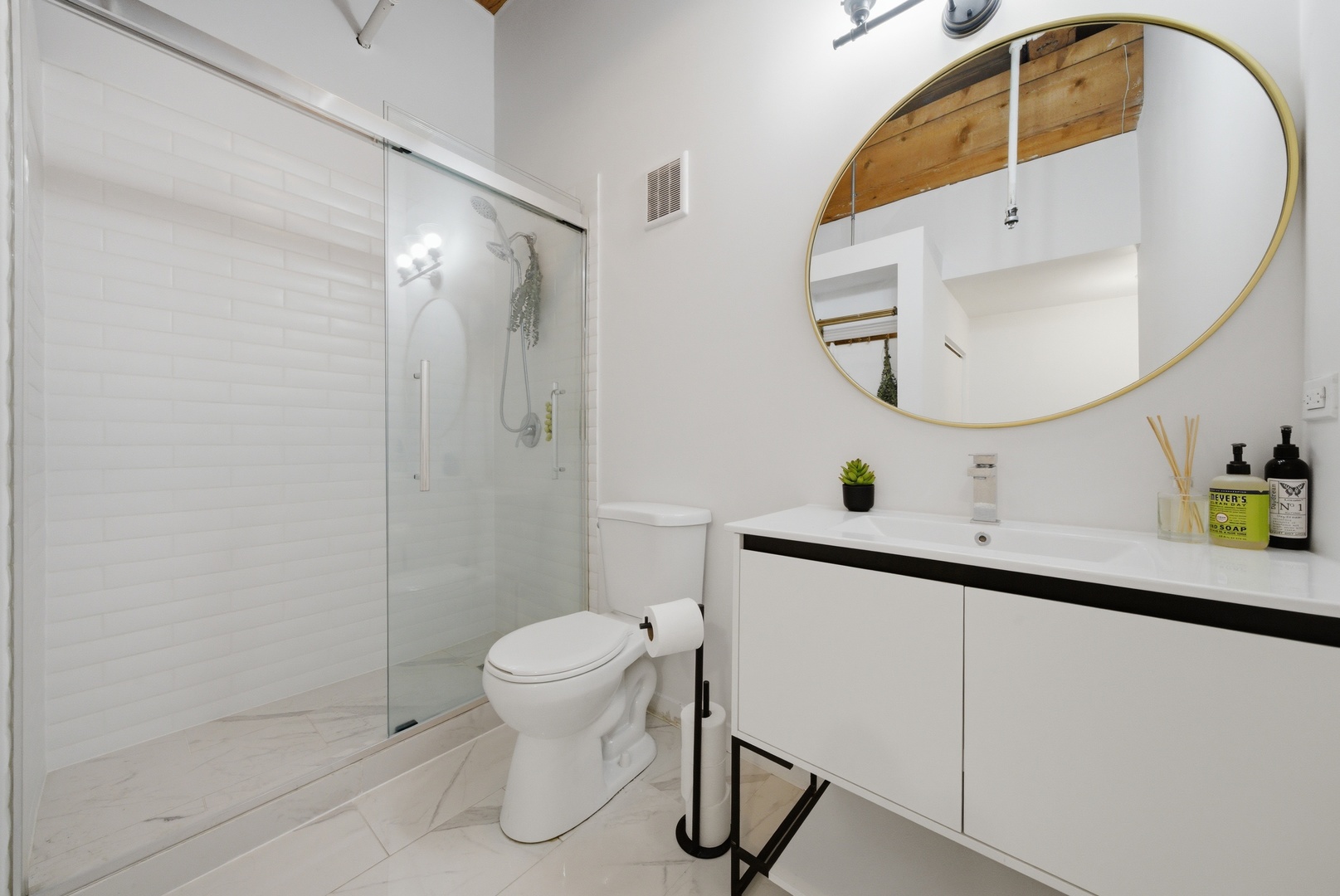 400 South Green Street, Unit 310 Chicago, IL 60607 - Photo 30 of 43 a bathroom with a sink mirror and toilet